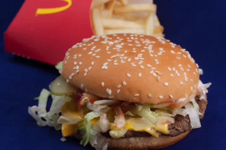 Quarter pounder with cheese, fries, and a drink arranged at a McDonald's in California