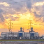 high voltage electricity tower in row