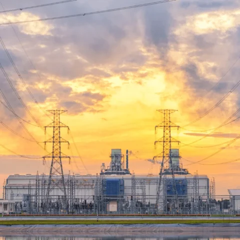 high voltage electricity tower in row