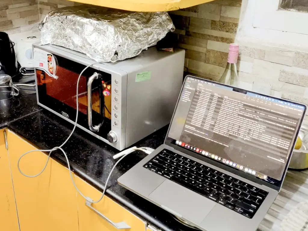 laptop and microwave with aluminum foil